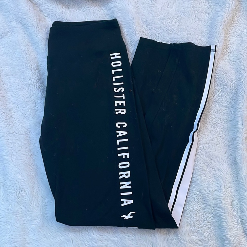 black leggings with logo design on side